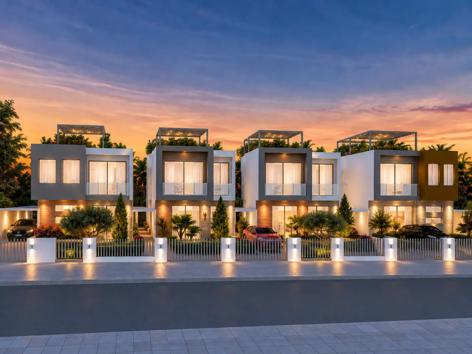 The four villas from the street at dusk